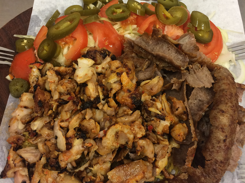 Mixed meat kebab with tomato and jalapeno